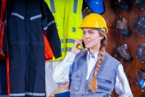 female civil engineer wearing PPE at warehouse workshop