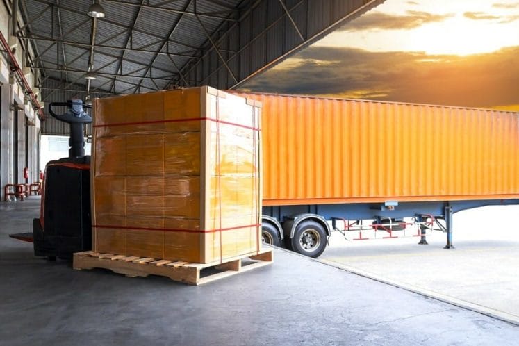 container truck parked in warehouse logistics facility