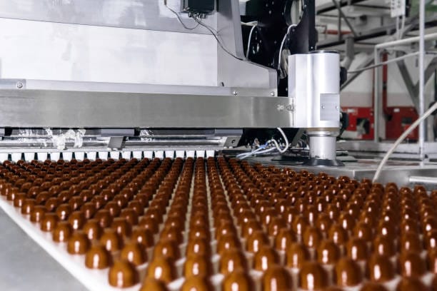 chocolate machinery producing sweet food products at a factory