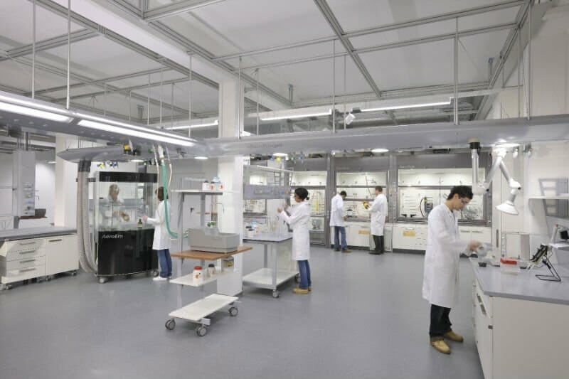 Hospital and pharmaceutical laboratory with chemical engineers working