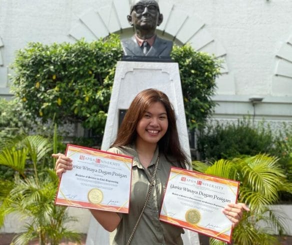 Engr. Yurice Winaya Pesigan holding sanitary engineering certificates