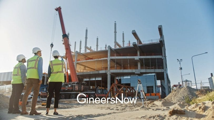 civil engineers at building construction site oversees contractors and project management