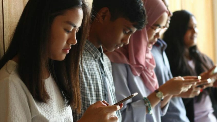 students using technology, mobile phone, smartphone, social media