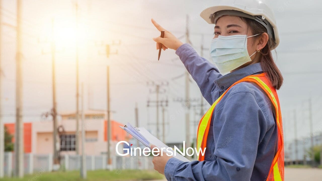 female electrical engineering pointing her hand in the air while looking for a job online